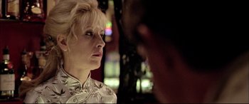 Movie still from “The Cooler” (2003), directed by Wayne Kramer – A woman looking at a man in front of a building; Close Up shot, Over the shoulder angle