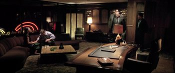 Movie still from “The Cooler” (2003), directed by Wayne Kramer – Two men in suits and ties in a room; Wide shot, High angle