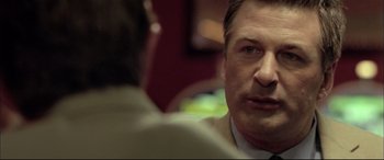 Movie still from “The Cooler” (2003), directed by Wayne Kramer – A person in a suit and tie; Close Up shot, Over the shoulder angle