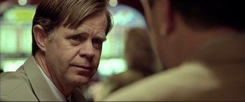 Movie still from “The Cooler” (2003), directed by Wayne Kramer – A person sitting in front of another person; Close Up shot, Over the shoulder angle