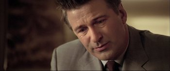 Movie still from “The Cooler” (2003), directed by Wayne Kramer – A person wearing a suit and tie; Close Up shot, Over the shoulder angle