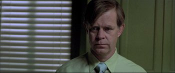 Movie still from “The Cooler” (2003), directed by Wayne Kramer – A person wearing a shirt and a tie; Close Up shot, Over the shoulder angle