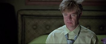 Movie still from “The Cooler” (2003), directed by Wayne Kramer – A person wearing a shirt and a tie; Close Up shot, Low angle