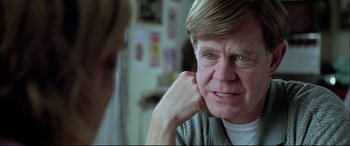 Movie still from “The Cooler” (2003), directed by Wayne Kramer – An older man looking at the camera in front of a mirror; Close Up shot, Over the shoulder angle