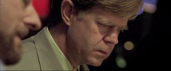 Movie still from “The Cooler” (2003), directed by Wayne Kramer – A person wearing a shirt and tie; Close Up shot, Low angle