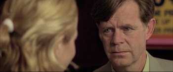 Movie still from “The Cooler” (2003), directed by Wayne Kramer – A man and a woman looking at one another in the mirror; Close Up shot, Over the shoulder angle