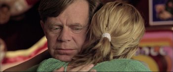 Movie still from “The Cooler” (2003), directed by Wayne Kramer – A man and a woman hugging each other; Close Up shot, Over the shoulder angle