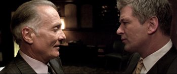 Movie still from “The Cooler” (2003), directed by Wayne Kramer – Two men are facing each other in a dark room; Close Up shot, Over the shoulder angle