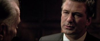 Movie still from “The Cooler” (2003), directed by Wayne Kramer – A person wearing a suit and tie; Close Up shot, Over the shoulder angle