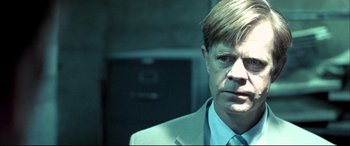 Movie still from “The Cooler” (2003), directed by Wayne Kramer – A person wearing a suit and tie; Close Up shot, Over the shoulder angle