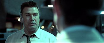 Movie still from “The Cooler” (2003), directed by Wayne Kramer – A person wearing a shirt and a tie; Close Up shot, Over the shoulder angle