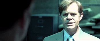 Movie still from “The Cooler” (2003), directed by Wayne Kramer – A person wearing a suit and tie; Close Up shot, Over the shoulder angle