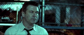 Movie still from “The Cooler” (2003), directed by Wayne Kramer – A man wearing a neck tie and a white dress shirt; Close Up shot, Low angle