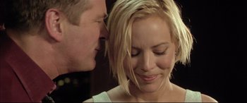 Movie still from “The Cooler” (2003), directed by Wayne Kramer – A man and a woman kissing in front of each other; Close Up shot, Over the shoulder angle