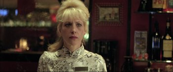 Movie still from “The Cooler” (2003), directed by Wayne Kramer – A woman with blonde hair wearing a white dress; Close Up shot, Low angle