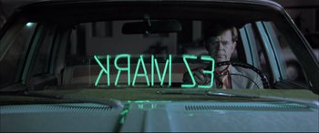 Movie still from “The Cooler” (2003), directed by Wayne Kramer – A man looking out of the window of a car; Medium shot, Low angle