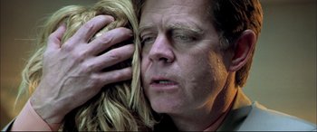 Movie still from “The Cooler” (2003), directed by Wayne Kramer – A person holding his head with one hand; Close Up shot, Low angle