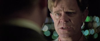 Movie still from “The Cooler” (2003), directed by Wayne Kramer – A man's face in front of blurry lights; Close Up shot, Over the shoulder angle