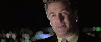 Movie still from “The Cooler” (2003), directed by Wayne Kramer – A person wearing a suit and tie; Close Up shot, Low angle