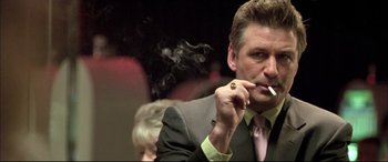 Movie still from “The Cooler” (2003), directed by Wayne Kramer – A person smoking a cigarette; Close Up shot, Low angle