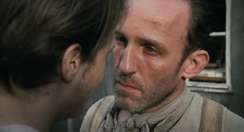 Movie still from “The Counterfeiters” (2007), directed by Stefan Ruzowitzky – A person looking at another person; Close Up shot, Over the shoulder angle