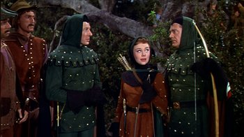 Movie still from “The Court Jester” (1955), directed by Melvin Frank – A group of people standing next to each other; Medium shot, High angle