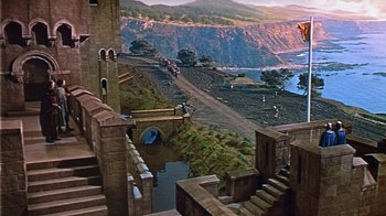 Movie still from “The Court Jester” (1955), directed by Melvin Frank – An aerial view of a river and a bridge; Extreme Wide shot, High angle