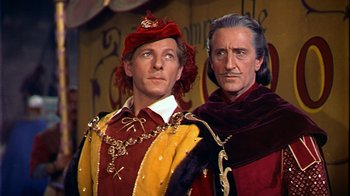 Movie still from “The Court Jester” (1955), directed by Melvin Frank – Two men dressed in medieval clothing standing next to each other; Medium shot, Low angle