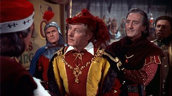 Movie still from “The Court Jester” (1955), directed by Melvin Frank – A group of men standing next to each other in costumes; Medium shot, Over the shoulder angle