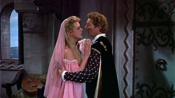 Movie still from “The Court Jester” (1955), directed by Melvin Frank – A man and a woman dressed as a bride and groom; Medium shot, High angle