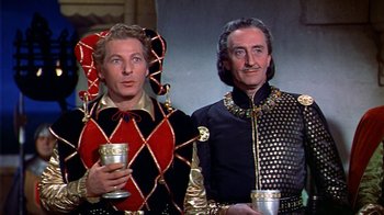 Movie still from “The Court Jester” (1955), directed by Melvin Frank – Two men dressed in medieval costumes holding cups; Medium shot, Low angle