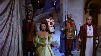 Movie still from “The Court Jester” (1955), directed by Melvin Frank – A group of people dressed in medieval garb; Wide shot, High angle