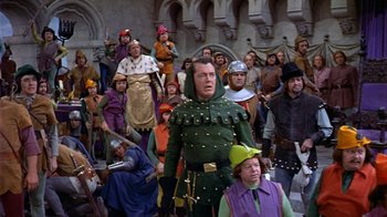 Movie still from “The Court Jester” (1955), directed by Melvin Frank – A group of people dressed in medieval costumes; Wide shot, High angle