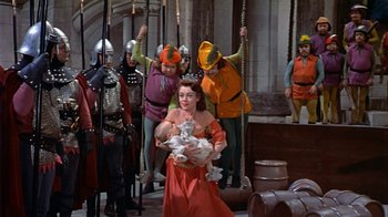 Movie still from “The Court Jester” (1955), directed by Melvin Frank – A group of people dressed in medieval garb; Wide shot, High angle