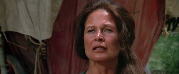 Movie still from “The Cowboys” (1972), directed by Mark Rydell – A woman's face looking at the camera; Close Up shot, Low angle