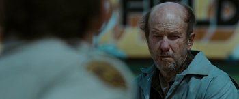 Movie still from “The Crazies” (2010), directed by Breck Eisner – A man with an angry look on his face; Close Up shot, Over the shoulder angle