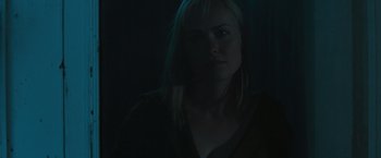 Movie still from “The Crazies” (2010), directed by Breck Eisner – A woman with blonde hair is in the dark; Close Up shot, Low angle