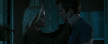Movie still from “The Crazies” (2010), directed by Breck Eisner – A man and a woman are looking into each others eyes; Close Up shot, Over the shoulder angle
