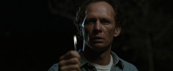 Movie still from “The Crazies” (2010), directed by Breck Eisner – A person holding a lit candle; Close Up shot, Low angle