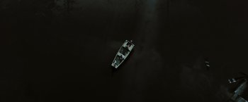 Movie still from “The Crazies” (2010), directed by Breck Eisner – An aerial view of a boat in a body of water; Extreme Wide shot, Overhead angle