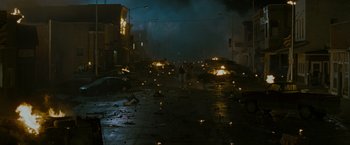Movie still from “The Crazies” (2010), directed by Breck Eisner – A city street filled with lots of debris and fires; Extreme Wide shot, High angle