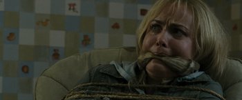 Movie still from “The Crazies” (2010), directed by Breck Eisner – A woman tied up with a rope around her face; Close Up shot, High angle
