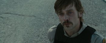 Movie still from “The Crazies” (2010), directed by Breck Eisner – A person with a nose ring; Close Up shot, Over the shoulder angle