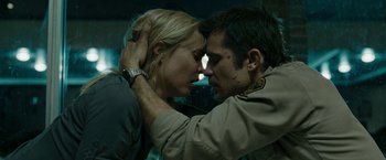 Movie still from “The Crazies” (2010), directed by Breck Eisner – A man and a woman are kissing in the dark; Close Up shot, Low angle