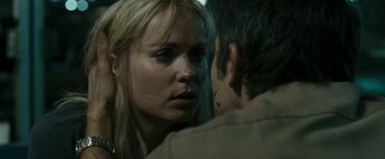 Movie still from “The Crazies” (2010), directed by Breck Eisner – A man and a woman face to face in a dark room; Close Up shot, Over the shoulder angle