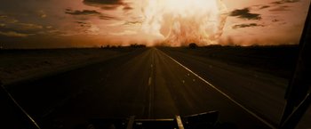 Movie still from “The Crazies” (2010), directed by Breck Eisner – A view from a car of a large cloud of smoke coming out of the sky; Extreme Wide shot, Low angle