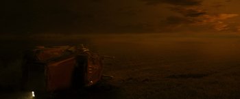 Movie still from “The Crazies” (2010), directed by Breck Eisner – An empty boat sitting on top of an empty field; Extreme Wide shot, High angle