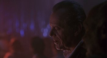 Movie still from “The Crossing Guard” (1995), directed by Sean Penn – A person with a blurry background; Close Up shot, Low angle