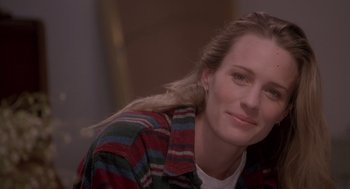 Movie still from “The Crossing Guard” (1995), directed by Sean Penn – A person wearing a shirt; Close Up shot, Over the shoulder angle