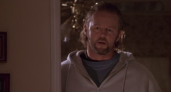 Movie still from “The Crossing Guard” (1995), directed by Sean Penn – A person wearing a hoodie; Close Up shot, Over the shoulder angle